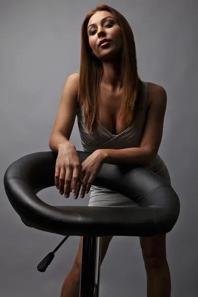 Beautiful girl pose near stylish armchair — Stock Photo, Image