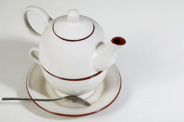 stock image Teapot on white table