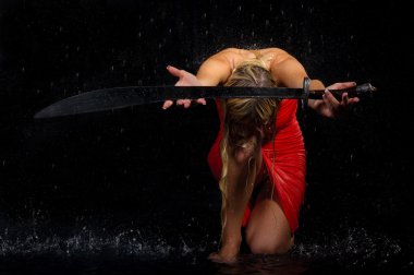 Sexual woman stretches sword clipart