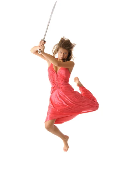 Jovem mulher no salto com espada — Fotografia de Stock