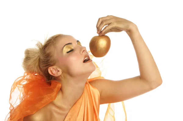 Beautiful woman in gold with gold apple — Stock Photo, Image