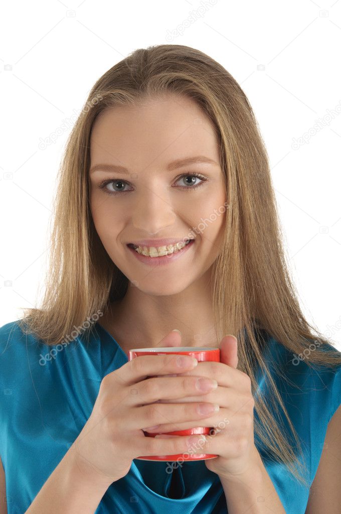 Woman with brackets on teeth and cup
