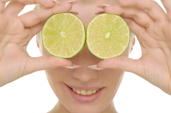 Young Woman Holds Halves Lime Eyes Isolated White — Stock Photo, Image