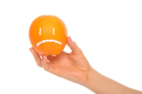 Mano sostiene naranja con insulto dibujado —  Fotos de Stock