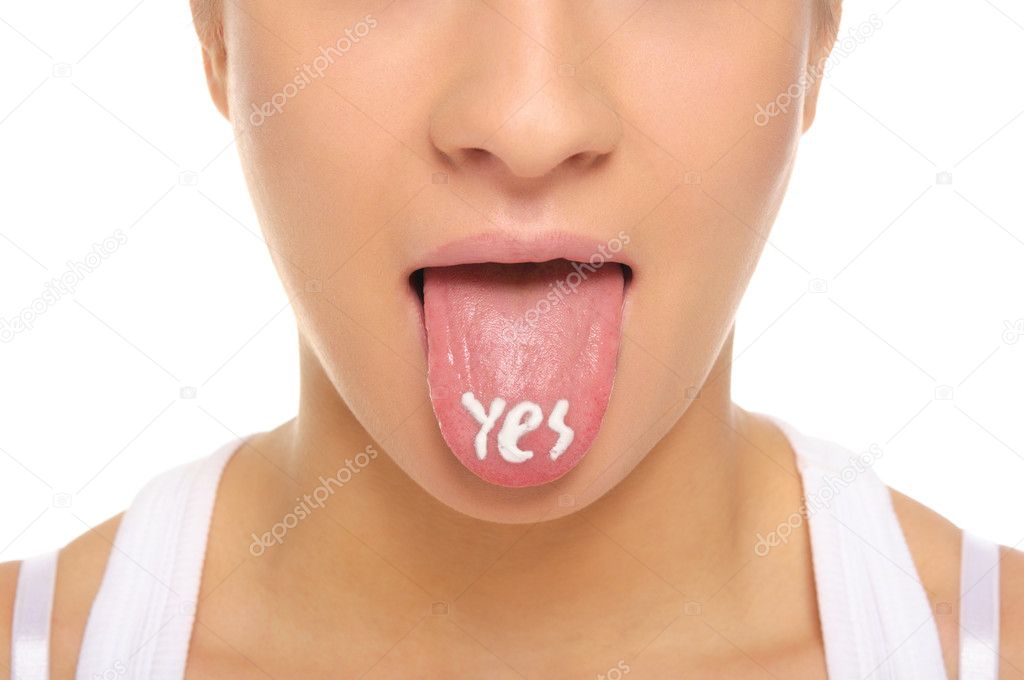Woman puts out the tongue with an inscription yes isolated in white
