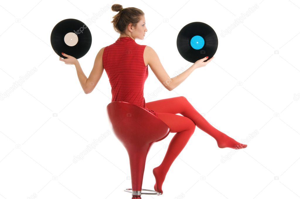 Young beautiful woman with vinyl records isolated in white