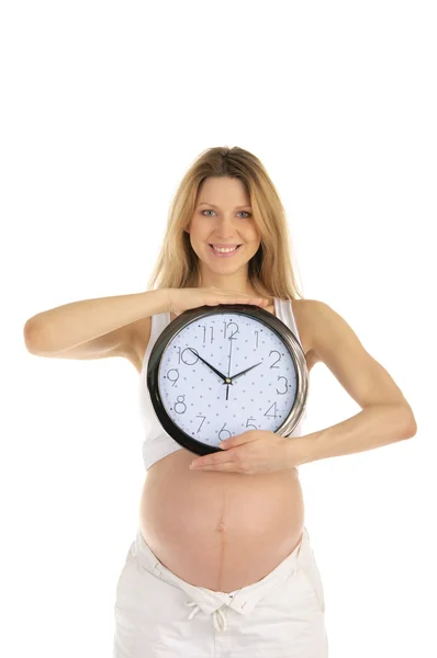 快乐孕妇与孤立在白色圆形时钟 — 图库照片