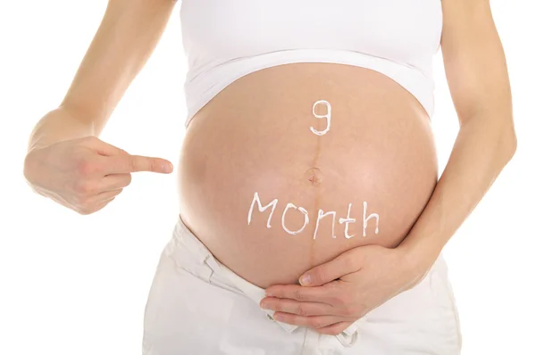 Magen van zwangere vrouwen met de inscriptie — Stockfoto