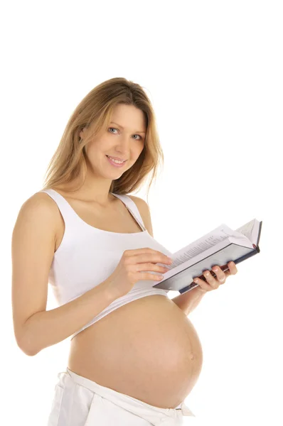 Mulher grávida lendo um livro — Fotografia de Stock