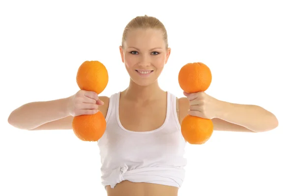 女子因从事健身哑铃的橘子 — 图库照片