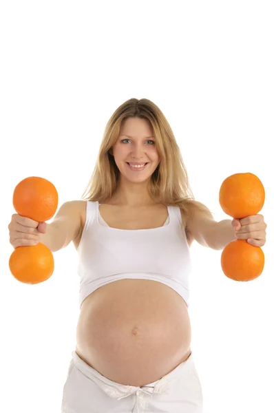 Hamile kadınların fitness portakal yer — Stok fotoğraf
