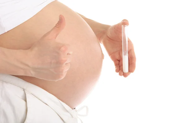 Pregnant woman holding a test tube with sperm — Stock Photo, Image