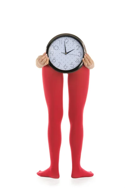 Nohy v červené punčochy a hodiny — Stock fotografie