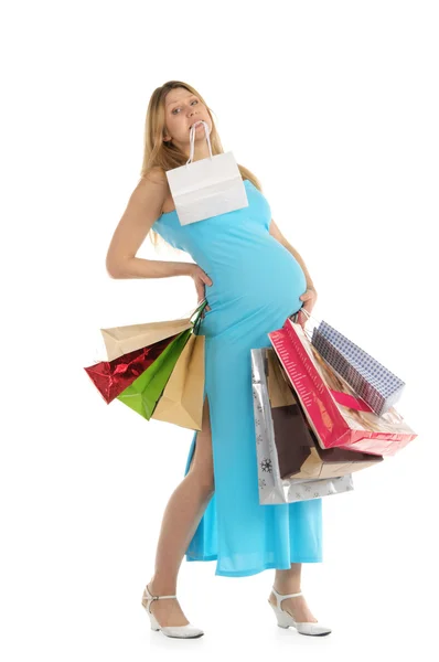 Уставшая беременная женщина с покупками — стоковое фото