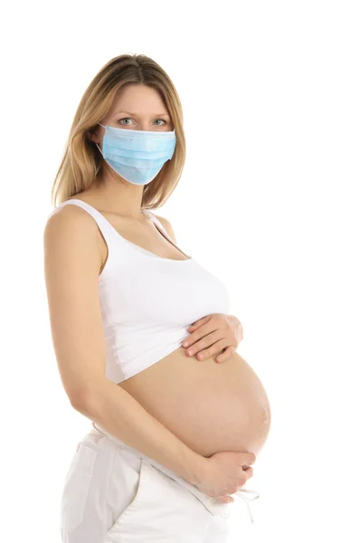 Těhotná žena v ochranné masce — Stock fotografie