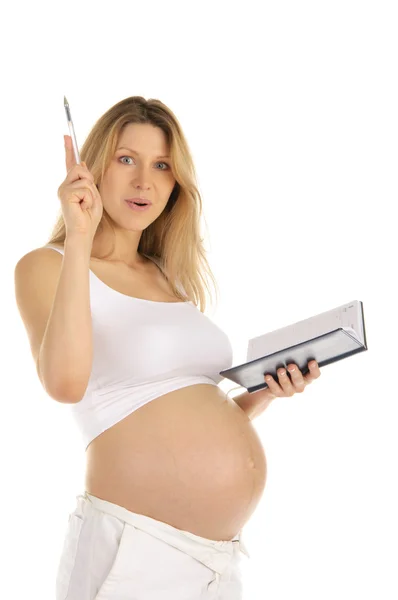 Sorprendido por la mujer embarazada con un bloc de notas — Foto de Stock