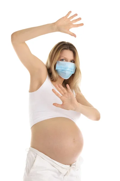 Mulher grávida em uma máscara protetora — Fotografia de Stock