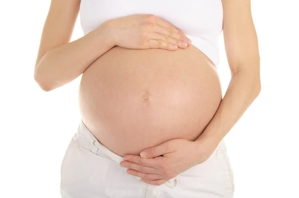 Karın hamile bir kadın destekleyici eller — Stok fotoğraf