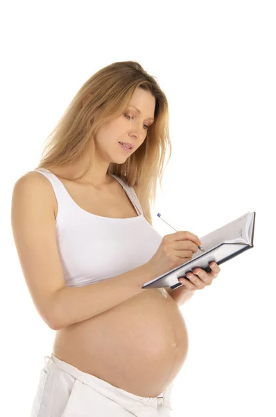 Pregnant woman down in a notebook Stock Photo