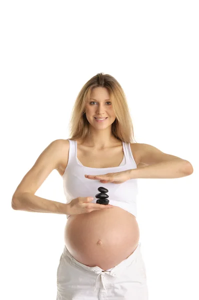 Femme enceinte avec des pierres — Photo