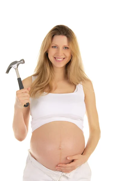 Szczęśliwa kobieta w ciąży z młotkiem, — Zdjęcie stockowe