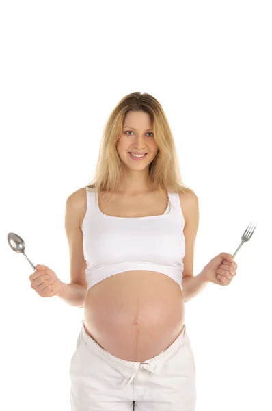 Těhotná žena s lžící a vidličkou — Stock fotografie