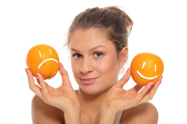 Woman with two oranges different emotions — Stock Photo, Image