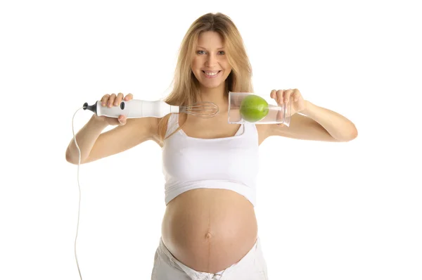 Femme enceinte avec un mélangeur et pomme — Photo