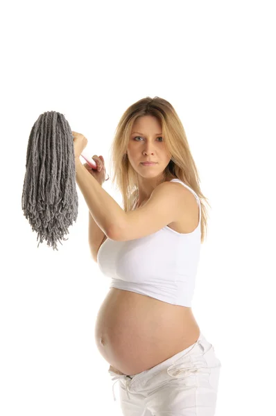 Angry pregnant woman with mop — Stock Photo, Image