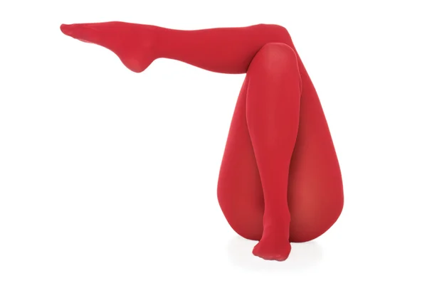 Kvinnliga ben i röda trikåer — Stockfoto