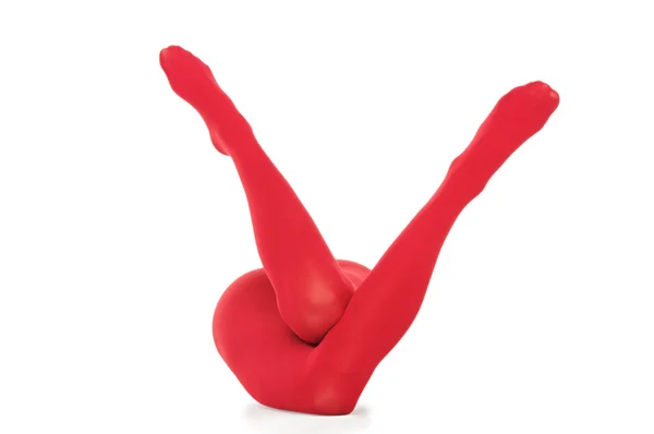 Kvinnliga ben i röda trikåer — Stockfoto