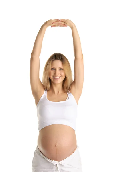 Těhotná žena cvičí jógu — Stock fotografie