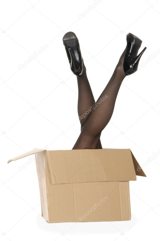 Women's legs sticking out of the box