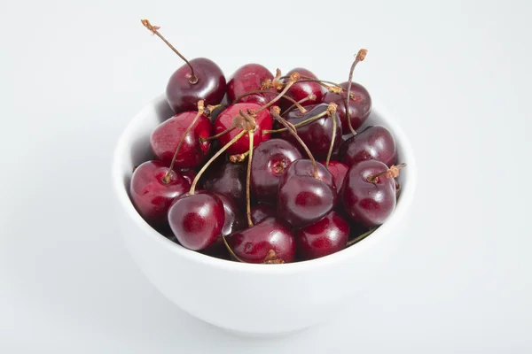 stock image A white bowl of cherries