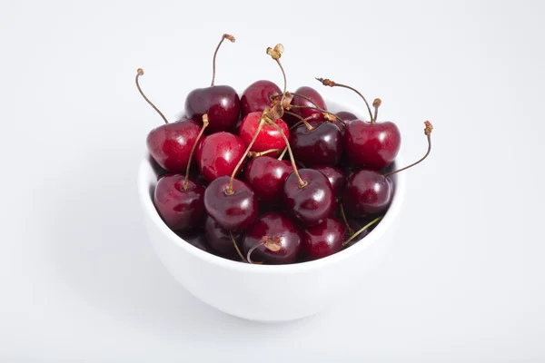 stock image A white bowl of cherries