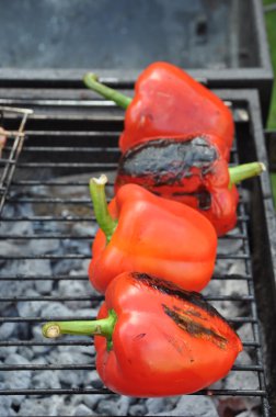 Grilling red peppers clipart