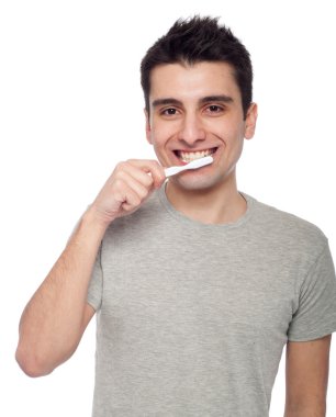 Young man brushing teeth clipart