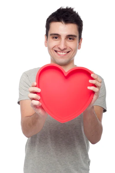 Casual man holding heart — Stock Photo, Image