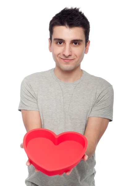 Casual man holding heart — Stock Photo, Image