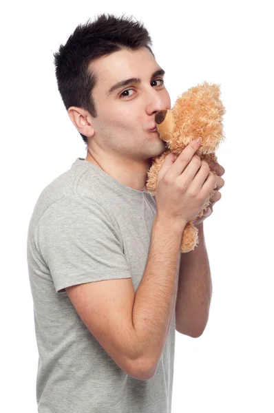 Homem beijando ursinho de pelúcia — Fotografia de Stock