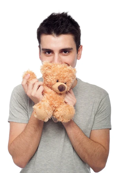 Man cuddling teddy bear — Stock Photo, Image