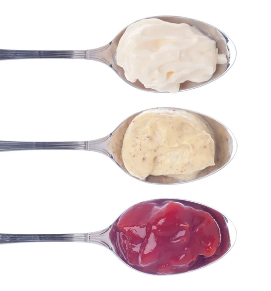 Sauces in spoons — Stock Photo, Image