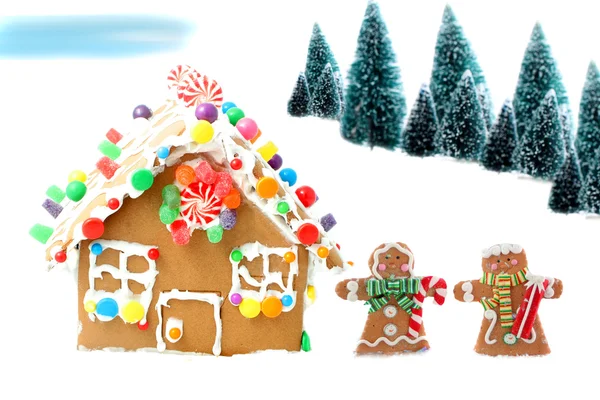 Gingerbread house with men and trees — Stock Image Gingerbread house with men and trees Royalty Free Stock Images