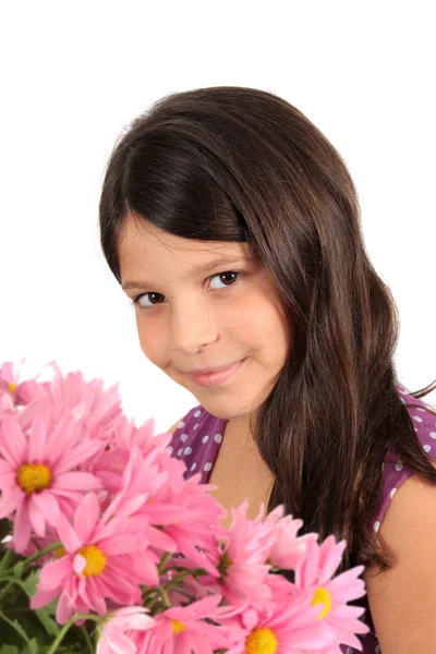 Pretty eight year old girl with flowers — Stock Photo, Image