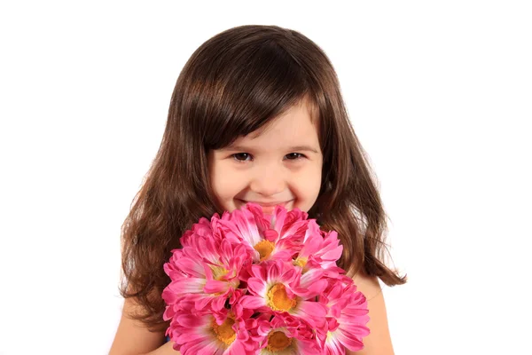 Pretty three year old girl with flowers — Stock Photo, Image