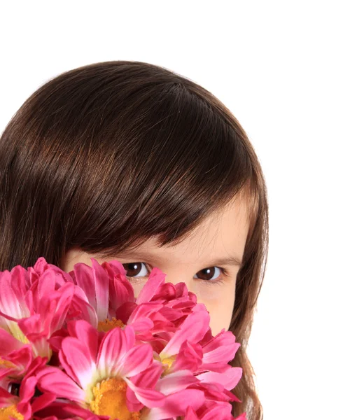 Pretty three year old girl with flowers — Stock Photo, Image
