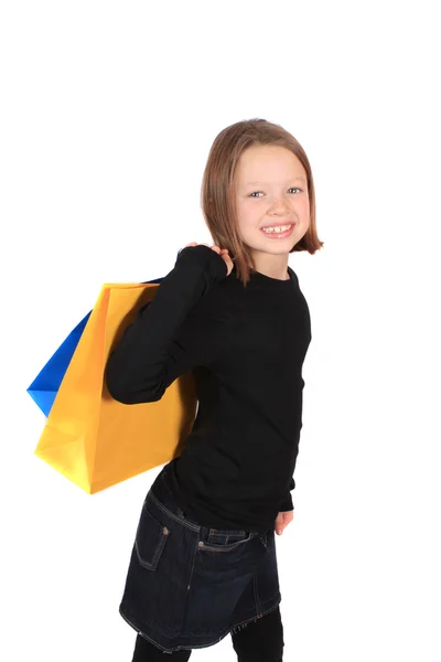 岁女孩与孤立在白色背景上的购物袋 — 图库照片