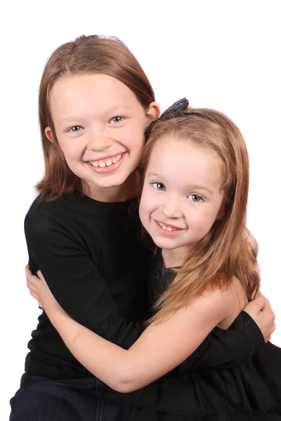 Two Cute Happy Young Girls Hugging Isolated White Background — Stock Fotó