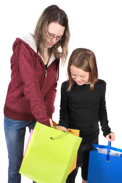Two girls looking in bags — Stock Photo, Image