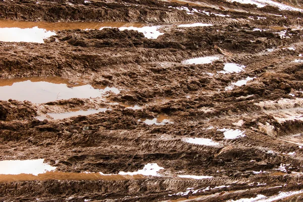 Road smutsiga lera vatten — Stockfoto